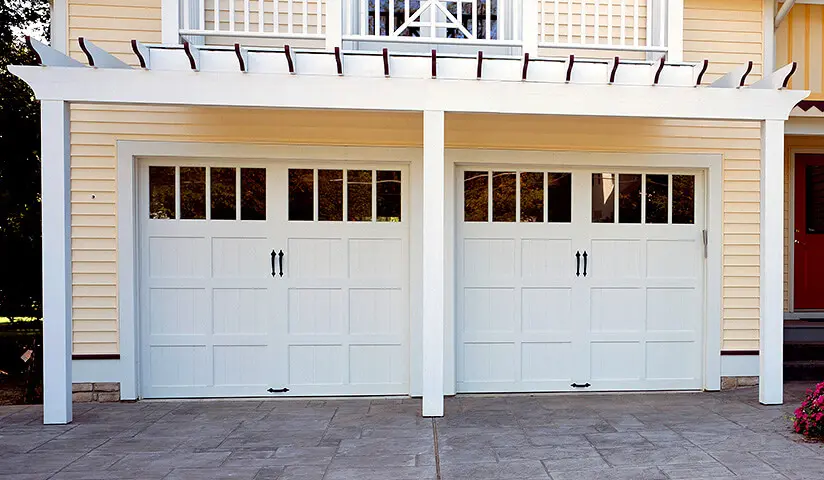 A garage with an entrance and two double doors